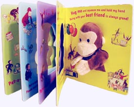 Curious George Pat-A-Cake Board Book showing opened pages